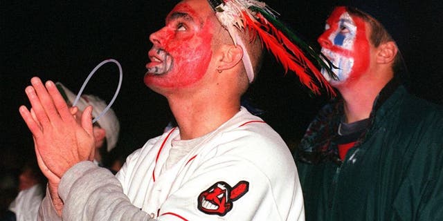 CLEVELAND, OH - OCTOBER 27: Cleveland Indians fans Pedro Rodriguez(L) and Pete Bogdan(R) watch the Indians play the Florida Marlins in game 7 of the World Series 26 October in downtown Cleveland. The Marlins defeated the Indians, 3-2, in 11 innings to win the 1997 World Series. (Photo credit should read KIMBERLY BARTH/AFP/Getty Images)