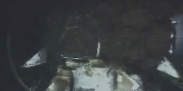 June 18: This image from video provided by BP PLC shows oil continuing to gush millions of gallons a day, from the broken wellhead, at the site of the Deepwater Horizon oil well in the Gulf of Mexico.