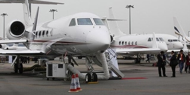 March 8: A Gulfstream G450 business jet, left, is displayed during the Asian Aerospace Show in Hong Kong .