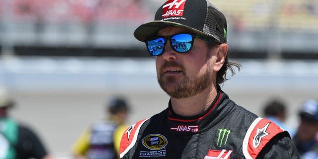 BROOKLYN, MI - JUNE 12: Kurt Busch, driver of the #41 Haas Automation/Monster Energy Chevrolet, stands on the grid prior to the NASCAR Sprint Cup Series FireKeepers Casino 400 at Michigan International Speedway on June 12, 2016 in Brooklyn, Michigan. (Photo by Josh Hedges/Getty Images )