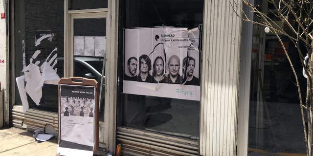 June 18, 2016: A ripped up poster advertising the streaming event of Radiohead's new album, at a record shop, in Istanbul.