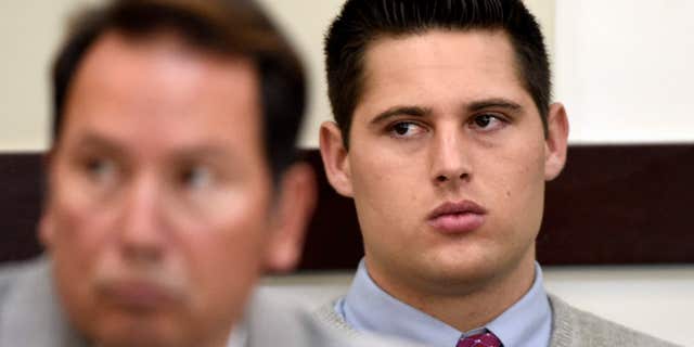 Brandon Vandenburg, right, a former Vanderbilt football player, listens during his rape trial Saturday, June 18, 2016, in Nashville, Tenn.