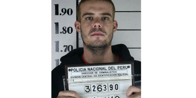 June 11: Dutch citizen Joran van der Sloot holds his inmate number before been transferred to the Miguel Castro Castro prison in Lima.