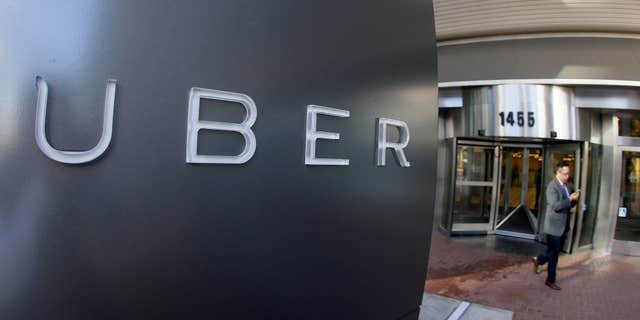 Dec. 16, 2014: A man leaves the headquarters of Uber in San Francisco.