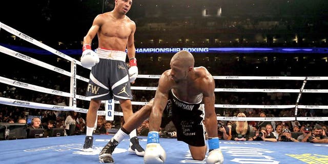 OAKLAND, CA - SEPTEMBER 08: Andre Ward (L) stands over Chad Dawson after he knocked him down in the third round of their WBA/WBC Super Middleweight championship fight at ORACLE Arena on September 8, 2012 in Oakland, California. Ward won by TKO in the 10th round. (Photo by Ezra Shaw/Getty Images)