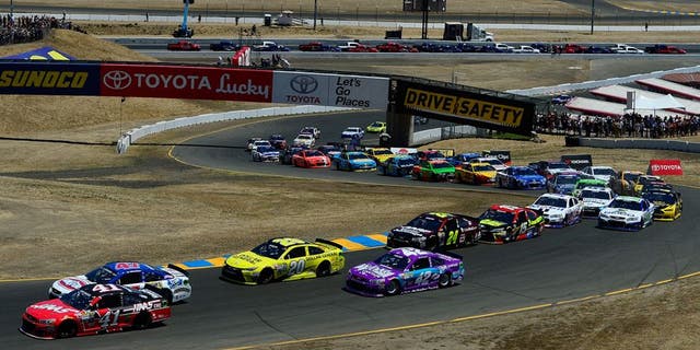 SONOMA, CA - JUNE 28: Kurt Busch, driver of the #41 Haas Automation Chevrolet, and AJ Allmendinger, driver of the #47 Kingsford Charcoal Chevrolet, lead the field at the start of the NASCAR Sprint Cup Series Toyota/Save Mart 350 at Sonoma Raceway on June 28, 2015 in Sonoma, California. (Photo by Robert Laberge/Getty Images)