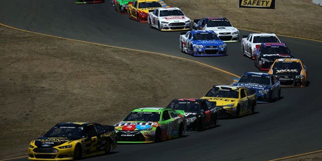 SONOMA, CA - JUNE 28: Brad Keselowski, driver of the #2 Alliance Truck Parts Ford, leads a pack of cars during the NASCAR Sprint Cup Series Toyota/Save Mart 350 at Sonoma Raceway on June 28, 2015 in Sonoma, California. (Photo by Patrick Smith/Getty Images)