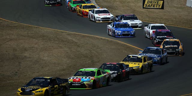 SONOMA, CA - JUNE 28: Brad Keselowski, driver of the #2 Alliance Truck Parts Ford, leads a pack of cars during the NASCAR Sprint Cup Series Toyota/Save Mart 350 at Sonoma Raceway on June 28, 2015 in Sonoma, California. (Photo by Patrick Smith/Getty Images)