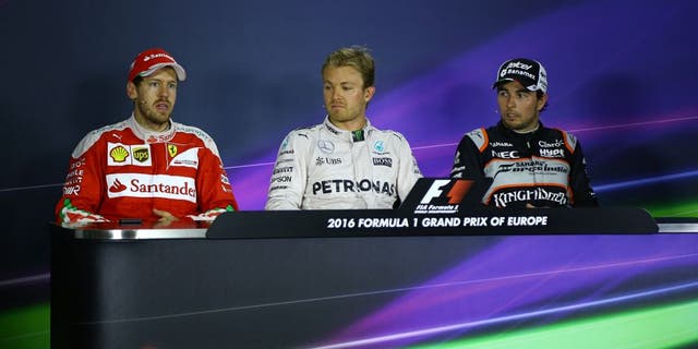 BAKU, AZERBAIJAN - JUNE 19: Nico Rosberg (C) of Mercedes AMG Pertronas F1 (C), Ferrari's Sebastian Vettel (L) and Sergio Perez (R) of Sahara Force India F1 attend a press conference during the 2016 Formula One Grand Prix of Europe in Baku, Azerbaijan on June 19, 2016. (Photo by Resul Rehimov/Anadolu Agency/Getty Images)