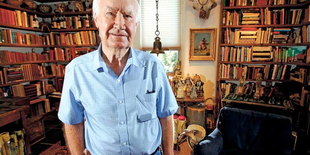 In this July 4, 2014 photo, Forrest Fenn poses at his Santa Fe, N.M., home.