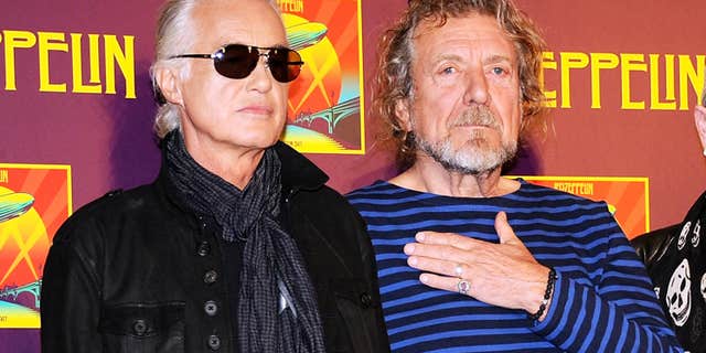 FILE - In this Oct. 9, 2012 file photo, Led Zeppelin guitarist Jimmy Page, left, and singer Robert Plant appear at a press conference ahead of the worldwide theatrical release of "Celebration Day," a concert film of their 2007 London O2 arena reunion show, in New York.