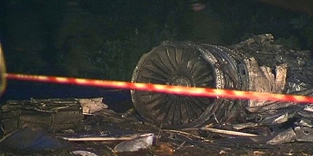 June 21: Personnel from the Russian emergency services walk at the site of a plane crash about 1 km (0.6 miles) from the runway at the airport outside the northern Russian city of Petrozavodsk in this still image taken from video footage.