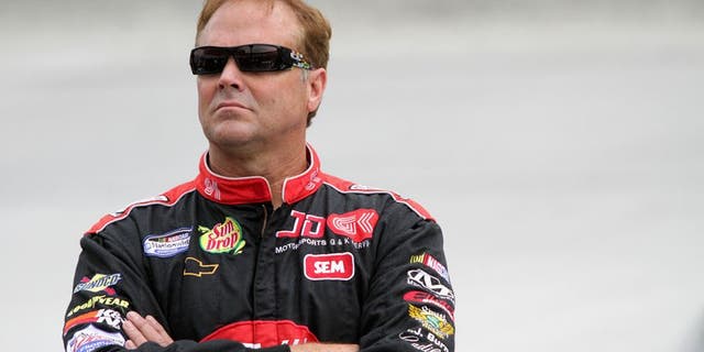 BRISTOL, TN - AUGUST 23: Mike Wallace, driver of the #01 teamjdmotorsports.com Chevrolet, looks on from the grid during qualifying for the NASCAR Nationwide Series Food City 250 at Bristol Motor Speedway on August 23, 2013 in Bristol, Tennessee. (Photo by Jerry Markland/Getty Images)