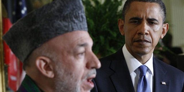 File: President Barack Obama, right, and Afghanistan's President Hamid Karzai, during a joint May 12 news conference in the East Room of the White House in Washington.