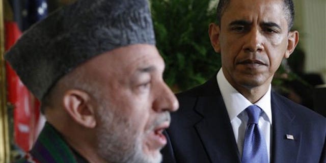 File: President Barack Obama, right, and Afghanistan's President Hamid Karzai, during a joint May 12 news conference in the East Room of the White House in Washington.