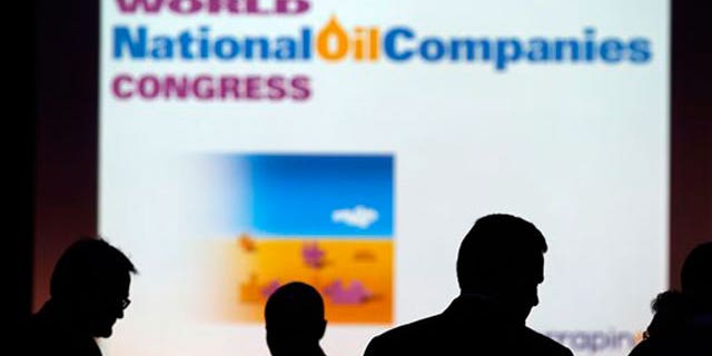 June 22: Delegates are seen during a break of the sessions of the World National Oil Companies Congress, in London.