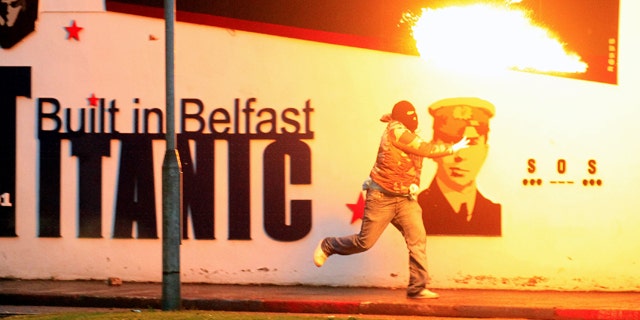 June 21: Loyalist rioters throw petrol bombs towards the mainly Catholic Short Strand area of East Belfast, Northern Ireland.