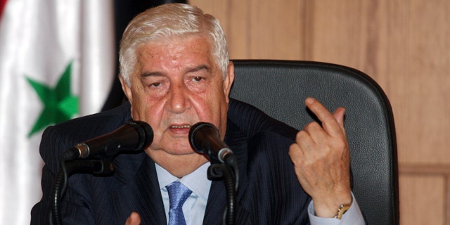 June 22: Syrian Foreign Minister Walid Moallem speaks during a news conference in Damascus, Syria.