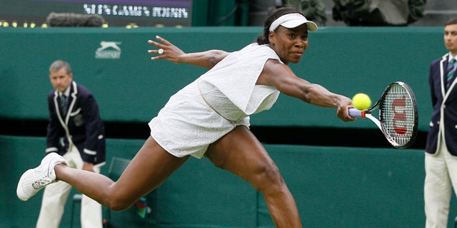 June 22: Venus Williams in action during the match against Kimiko Date-Krumm at the All England Lawn Tennis Championships at Wimbledon.