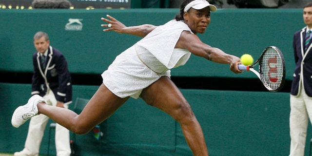 June 22: Venus Williams in action during the match against Kimiko Date-Krumm at the All England Lawn Tennis Championships at Wimbledon.