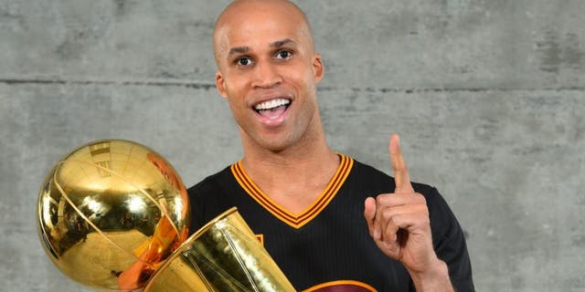 Richard Jefferson of the Cleveland Cavaliers poses with the NBA's Larry O'Brien Trophy after winning the NBA Championship against the Golden State Warriors, June 19, 2016, at Oracle Arena in Oakland, Calif. (Getty Images)