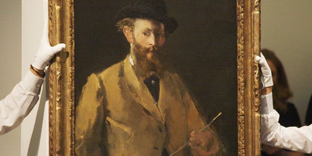 June 22: View of French Impressionist Edouard Manet's 'Self Portrait,' which sold at auction at Sotheby's in London for $33 million.
