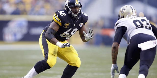 Nov 30, 2014; Pittsburgh, PA, USA; Pittsburgh Steelers tackle Kelvin Beachum (68) blocks at the line of scrimmage against New Orleans Saints outside linebacker Junior Galette (93) during the third quarter at Heinz Field. The Saints won 35-32. Mandatory Credit: Charles LeClaire-USA TODAY Sports