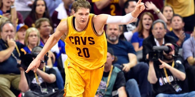 Jun 11, 2015; Cleveland, OH, USA; Cleveland Cavaliers center Timofey Mozgov (20) reacts during the third quarter of game four of the NBA Finals against the Golden State Warriors at Quicken Loans Arena.