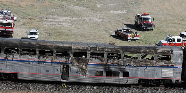 June 24: An Amtrak coach car is seen at the site of a collision between an Amtrak westbound train and a truck on U.S. 95 about 4 miles south of Interstate 80, 70 miles east of Reno, Nev.