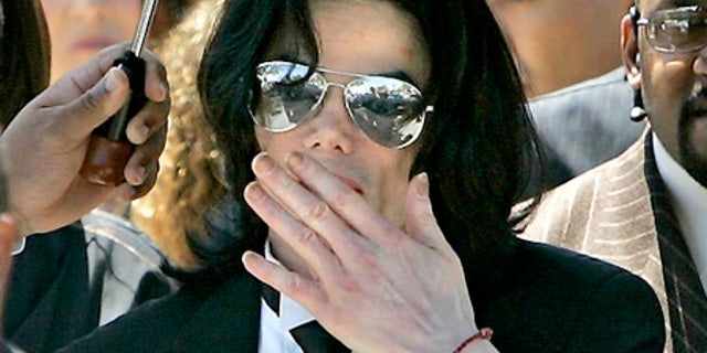 June 13, 2005: Michael Jackson blows a kiss to his fans as he leaves the Santa Barbara County Courthouse in Santa Maria, Calif.