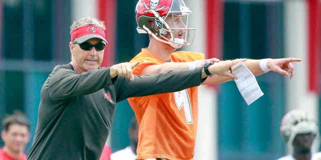May 28, 2015; Tampa, FL, USA; Tampa Bay Buccaneers offensive coordinator Dirk Koetter and quarterback Seth Lobato (4) work out at One Buc Place. Mandatory Credit: Kim Klement-USA TODAY Sports