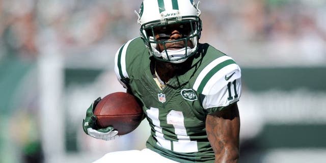 Oct 20, 2013; East Rutherford, NJ, USA; New York Jets wide receiver Jeremy Kerley (11) makes a move after making a catch against the New England Patriots during the first half at MetLife Stadium. Mandatory Credit: Joe Camporeale-USA TODAY Sports