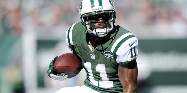 Oct 20, 2013; East Rutherford, NJ, USA; New York Jets wide receiver Jeremy Kerley (11) makes a move after making a catch against the New England Patriots during the first half at MetLife Stadium. Mandatory Credit: Joe Camporeale-USA TODAY Sports