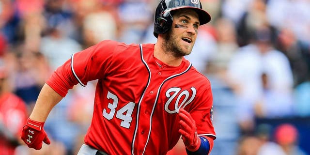 Apr 13, 2014; Atlanta, GA, USA; Washington Nationals left fielder Bryce Harper (34) runs to first on a double in the sixth inning against the Atlanta Braves at Turner Field. Mandatory Credit: Daniel Shirey-USA TODAY Sports
