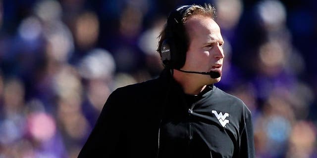 FORT WORTH, TX - NOVEMBER 02: Head coach Dana Holgorsen of the West Virginia Mountaineers watches from the sidelines during the game against the TCU Horned Frogs at Amon G. Carter Stadium on November 2, 2013 in Fort Worth, Texas. (Photo by Jamie Squire/Getty Images)