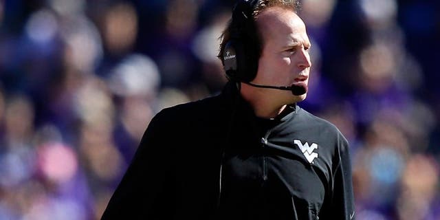 FORT WORTH, TX - NOVEMBER 02: Head coach Dana Holgorsen of the West Virginia Mountaineers watches from the sidelines during the game against the TCU Horned Frogs at Amon G. Carter Stadium on November 2, 2013 in Fort Worth, Texas. (Photo by Jamie Squire/Getty Images)