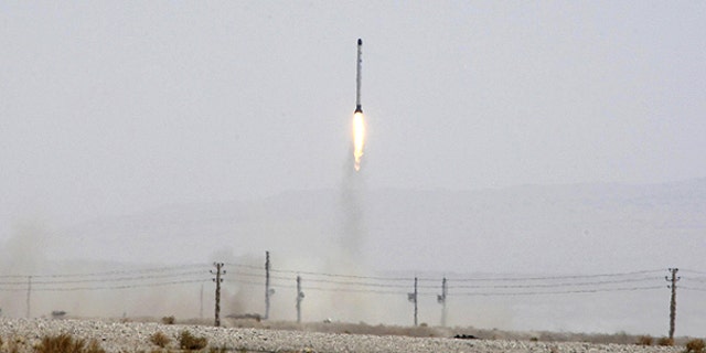 This file photo released June 16, 2011, by the Iranian Defense Ministry, claims to show launching the Safir, or Ambassador, satellite carrier, which carries Iran's Rasad, or Observation, satellite into earth orbit, in an undisclosed location.