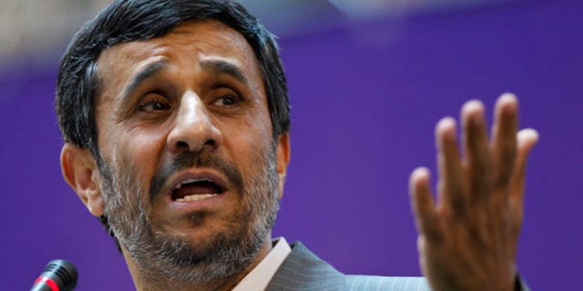 June 20: Iranian President Mahmoud Ahmadinejad gestures while speaking in the International Conference of Islamic World Publishers in Tehran.