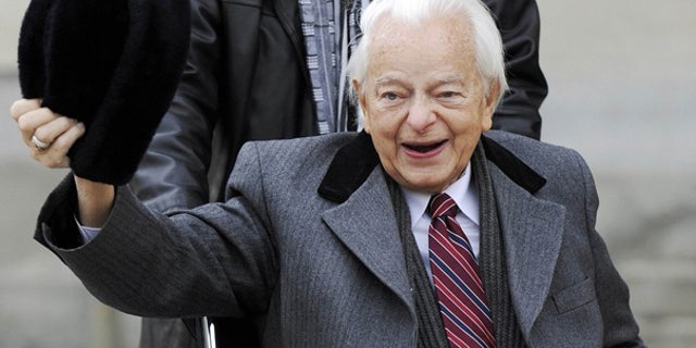 Feb. 2009: Sen. Robert Byrd doffs his hat for reporters as he arrives at the Capitol in Washington.