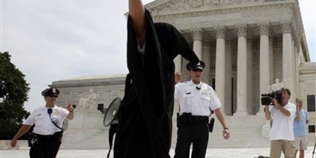 Anti-abortion protesters demonstrate in front of the Supreme Count in Washington, Monday, June 28, 2010. (AP)