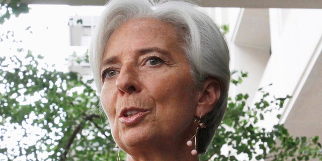 June 23: French Finance Minister Christine Lagarde speaks to the media outside the International Monetary Fund in Washington.