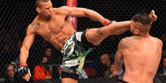 HOLLYWOOD, FL - JUNE 27: (L-R) Thiago Santos of Brazil lands a kick to the head of Steve Bosse of Canada in their middleweight during the UFC Fight Night event at the Hard Rock Live on June 27, 2015 in Hollywood, Florida. (Photo by Josh Hedges/Zuffa LLC/Zuffa LLC via Getty Images)