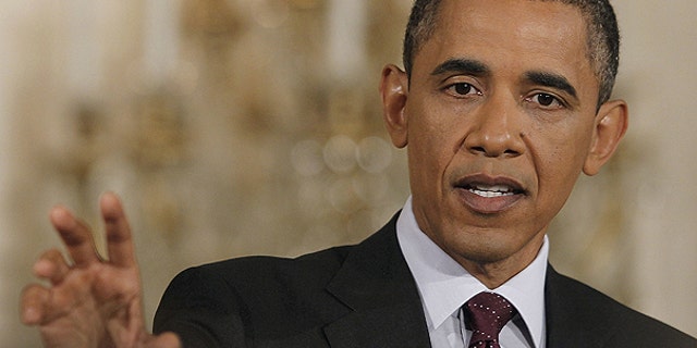 June 29: President Obama gestures during a news conference in the East Room of the White House in Washington.