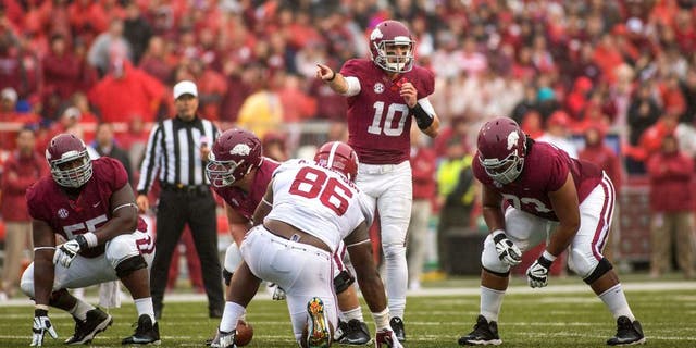 Oct 11, 2014; Fayetteville, AR, USA; Arkansas Razorbacks quarterback Brandon Allen (10) makes a call as offensive lineman Denver Kirkland (55) and offensive tackle Sebastian Tretola (73) and Alabama Crimson Tide defensive lineman A'Shawn Robinson (86) line up during a game at Donald W. Reynolds Razorback Stadium. Alabama defeated Arkansas 14-13. Mandatory Credit: Beth Hall-USA TODAY Sports