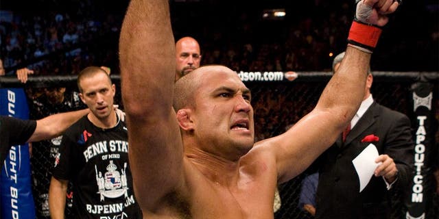 PHILADELPHIA - AUGUST 8: BJ Penn (white shorts) def. Kenny Florian (black shorts) - Submission (rear naked choke) - 3:54 round 4 during UFC 101 at Wachovia Center on August 8, 2009 in Philadelphia, Pennsylvania. (Photo by Josh Hedges/Zuffa LLC via Getty Images)
