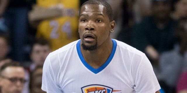 OKLAHOMA CITY, OK - APRIL 11: Kevin Durant #35 of the Oklahoma City Thunder brings the ball down court against the Los Angeles Lakers during a NBA game at the Chesapeake Energy Arena on April 11, 2016 in Oklahoma City, Oklahoma. NOTE TO USER: User expressly acknowledges and agrees that, by downloading and or using this photograph, User is consenting to the terms and conditions of the Getty Images License Agreement. (Photo by J Pat Carter/Getty Images)