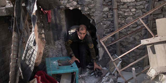 June 28, 2017: An Iraqi special forces soldier moves towards the frontline near the al-Nuri mosque during fights against Islamic State militants in the Old City of Mosul, Iraq.
