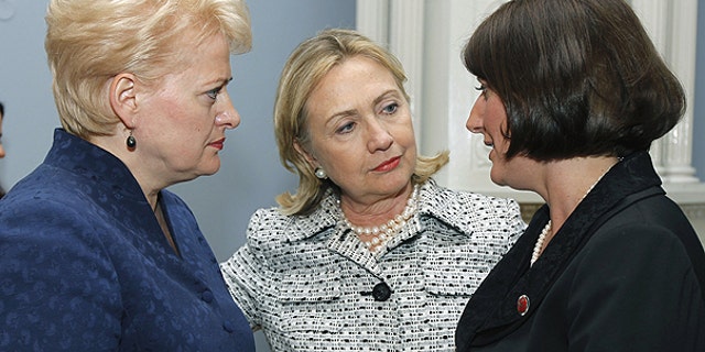 June 30: From left, Lithuania's President Dalia Grybauskaite, Secretary of State Hillary Clinton , and Kosovo President Atifete Jahjaga, speak at the Presidential Palace in Vilnius, Lithuania.