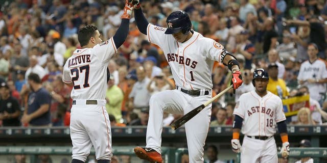 Jun 29, 2015; Houston, TX, USA; Houston Astros shortstop Carlos Correa (1) celebrates with second baseman Jose Altuve (27) after a home-run against the Kansas City Royals in the third inning at Minute Maid Park. Mandatory Credit: Thomas B. Shea-USA TODAY Sports
