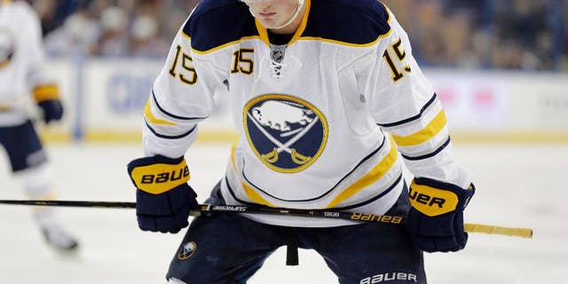 FILE - In this Nov. 10, 2015, file photo, Buffalo Sabres center Jack Eichel (15) gets ready for a faceoff against the Tampa Bay Lightning during the third period of an NHL hockey game in Tampa, Fla. Eichel was helped off the ice after hurting his left leg during practice on Wednesday, Oct. 12, 2016. he was in front of the net when he got tangled up with a defensemen and his leg buckled beneath him. The injury occurred a day before the Sabres open the season hosting the Montreal Canadiens. (AP Photo/Chris O'Meara, File)